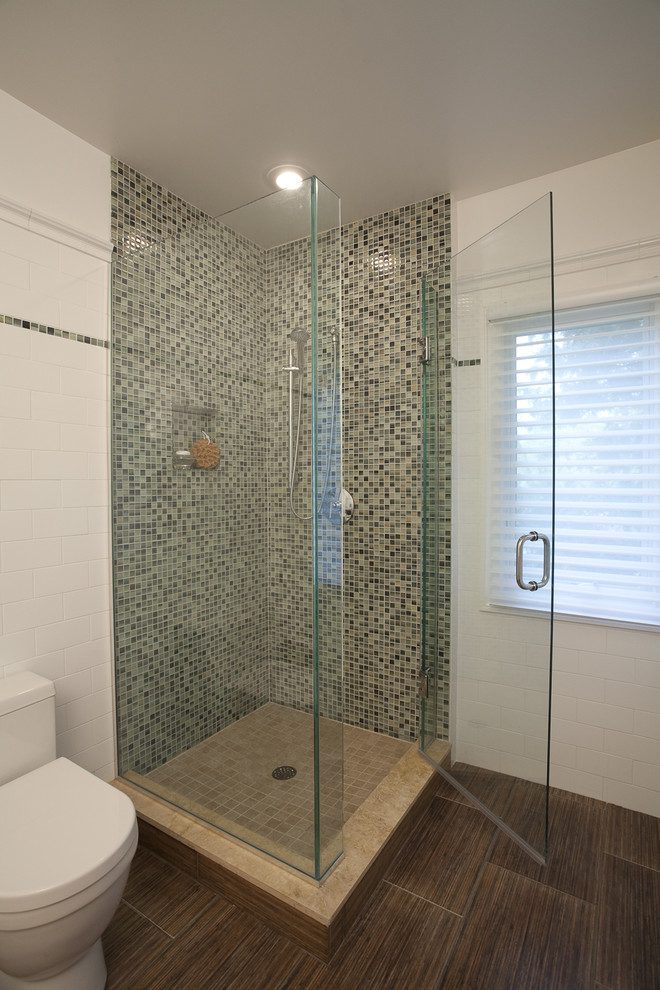 Inspiration for a mid-sized 3/4 brown tile mosaic tile floor alcove shower remodel in DC Metro with flat-panel cabinets, medium tone wood cabinets, a one-piece toilet, white walls and solid surface countertops