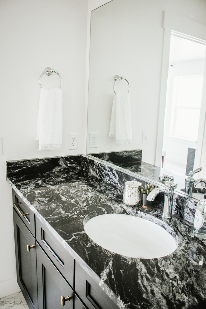 Photo of a victorian bathroom in Salt Lake City with shaker cabinets, black cabinets, stone slabs, white walls, porcelain flooring, a submerged sink, granite worktops, white floors and black worktops.