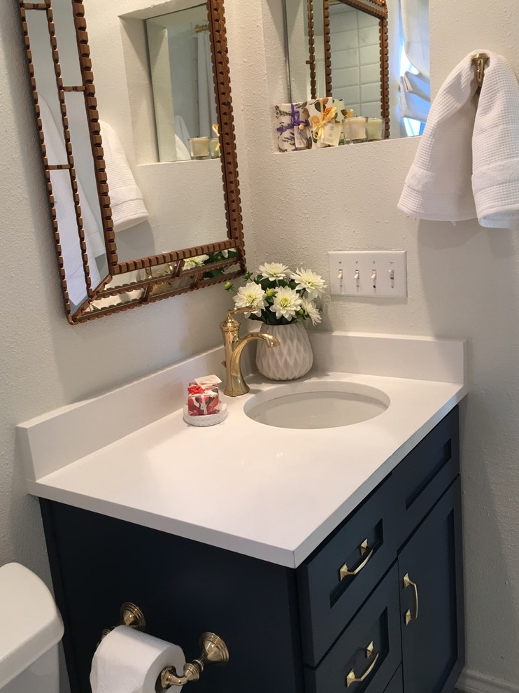 Inspiration for a small contemporary 3/4 white tile and ceramic tile ceramic tile and gray floor bathroom remodel in Austin with shaker cabinets, black cabinets, a two-piece toilet, white walls, an undermount sink, quartz countertops and white countertops