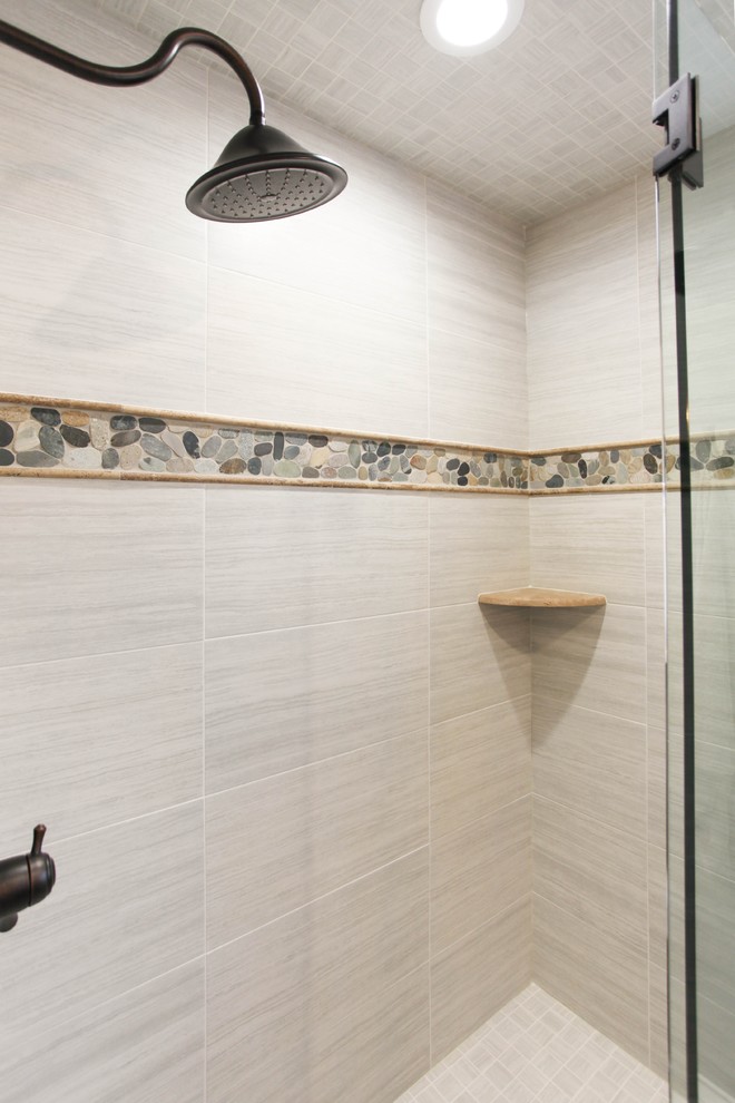 Alcove shower - mid-sized farmhouse gray tile and porcelain tile porcelain tile alcove shower idea in Chicago with raised-panel cabinets, distressed cabinets, a two-piece toilet, gray walls, a vessel sink and wood countertops