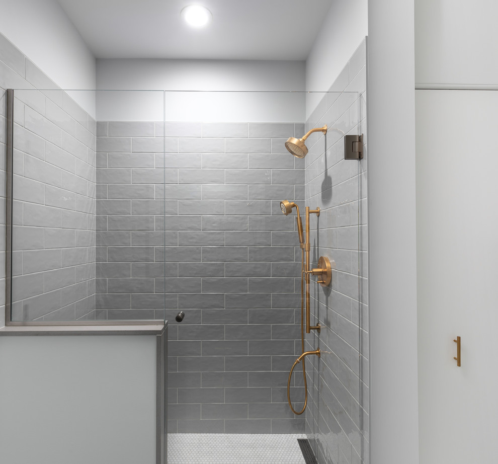 This is an example of a medium sized eclectic ensuite bathroom in Detroit with an alcove shower, grey tiles, white walls, marble flooring, a hinged door and white floors.