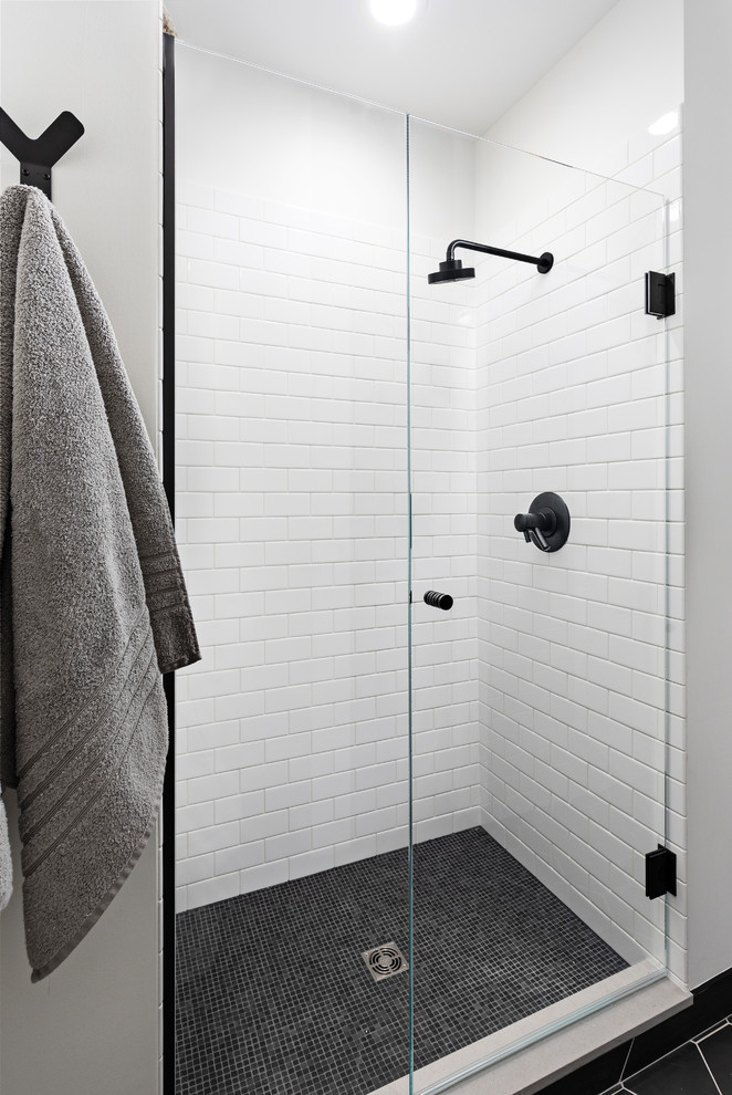 Medium sized eclectic shower room bathroom in Detroit with recessed-panel cabinets, medium wood cabinets, an alcove shower, a two-piece toilet, white tiles, metro tiles, white walls, ceramic flooring, a vessel sink, black floors, a hinged door, grey worktops and concrete worktops.