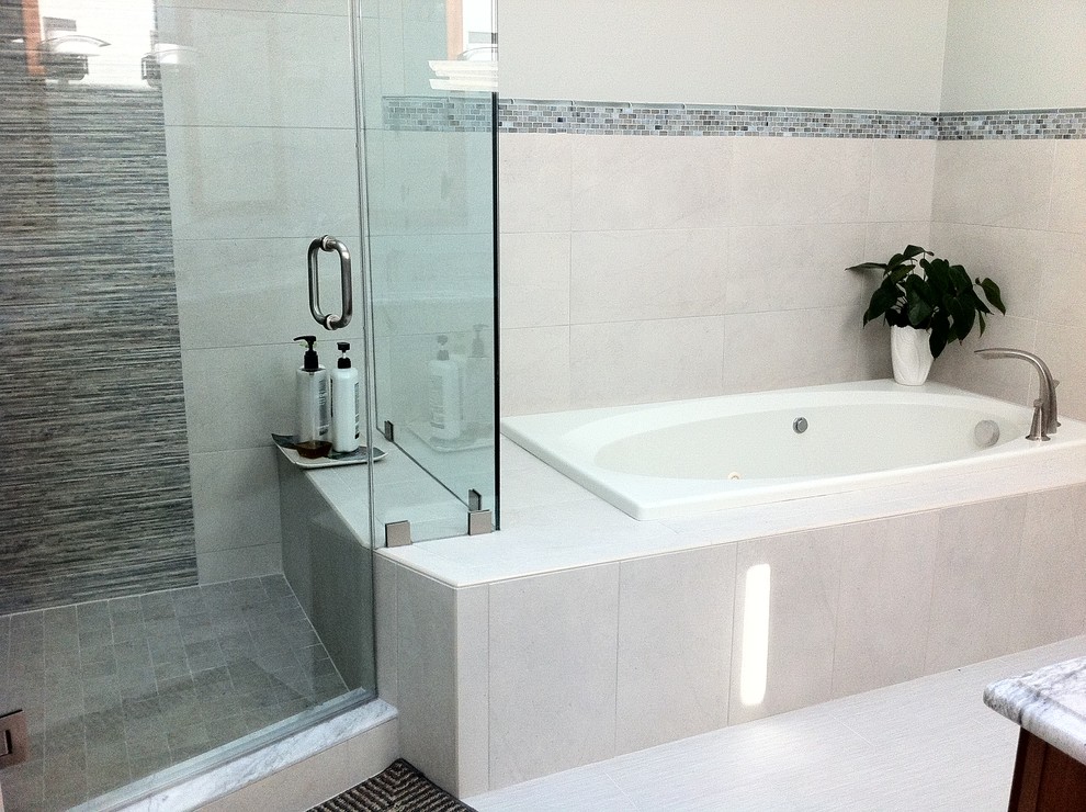 Inspiration for a medium sized contemporary ensuite bathroom in Bridgeport with a submerged sink, raised-panel cabinets, medium wood cabinets, granite worktops, a built-in bath, a corner shower, a two-piece toilet, white tiles, porcelain tiles, green walls and porcelain flooring.