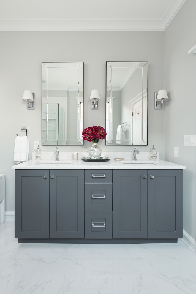 Mid-sized trendy master white tile and mosaic tile mosaic tile floor and white floor bathroom photo in Chicago with raised-panel cabinets, gray cabinets, a two-piece toilet, beige walls, an undermount sink and quartz countertops