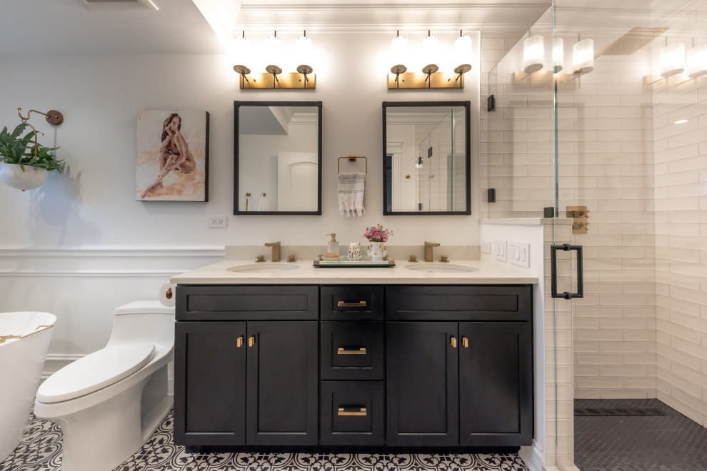 Example of a large farmhouse master white tile porcelain tile, black floor and double-sink bathroom design with recessed-panel cabinets, black cabinets, white walls, an undermount sink, quartz countertops, white countertops and a built-in vanity