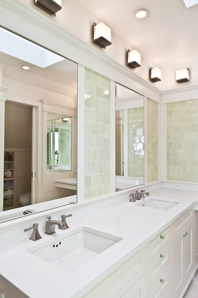 Alcove shower - mid-sized traditional kids' green tile and ceramic tile marble floor and white floor alcove shower idea in Chicago with an undermount sink, shaker cabinets, white cabinets, quartz countertops, a two-piece toilet, white walls and a hinged shower door