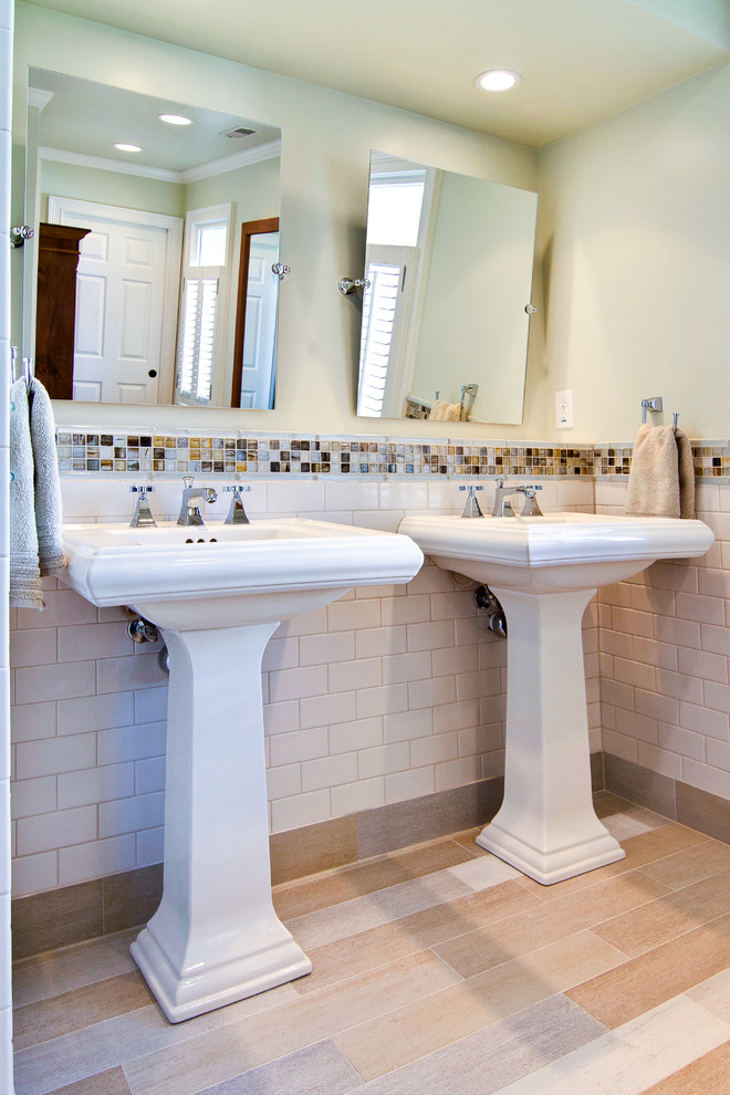 Example of a trendy white tile and subway tile bathroom design in Atlanta with a pedestal sink