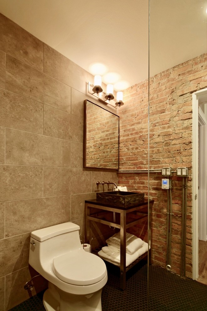 Photo of a medium sized urban shower room bathroom in Chicago with open cabinets, a walk-in shower, brown tiles, porcelain tiles, a one-piece toilet, brown walls, a vessel sink, black floors and an open shower.