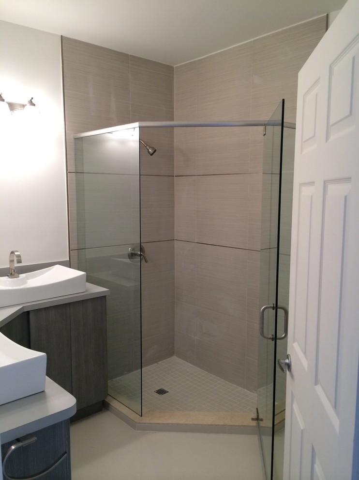 Mid-sized trendy 3/4 beige tile and porcelain tile marble floor corner shower photo in Miami with a console sink, flat-panel cabinets, distressed cabinets, laminate countertops, a one-piece toilet and white walls