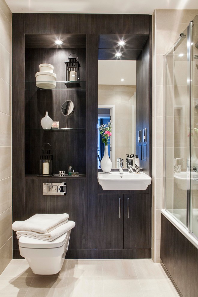 Photo of a contemporary bathroom in London with a wall-mounted sink, dark wood cabinets, a corner shower, a wall mounted toilet and flat-panel cabinets.