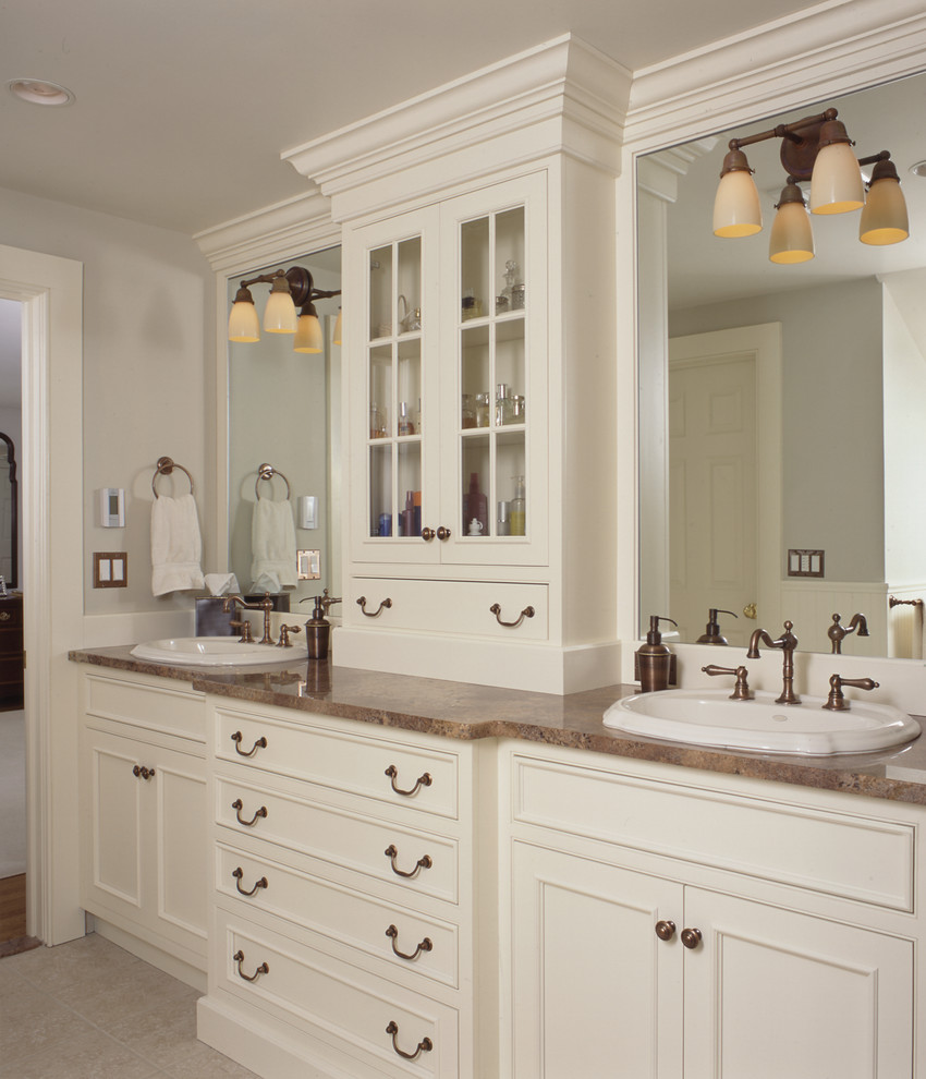 Classic ensuite bathroom in New York with raised-panel cabinets, white cabinets and white walls.