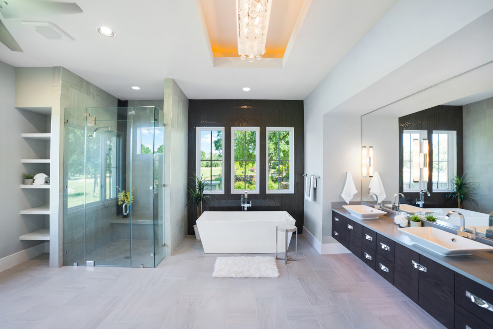 Large trendy master bathroom photo in Austin with flat-panel cabinets, dark wood cabinets, gray walls and a vessel sink