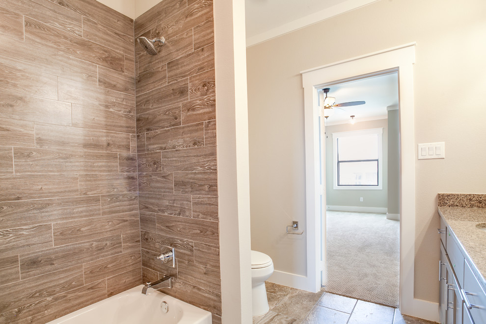 Example of a mid-sized country kids' brown tile and ceramic tile ceramic tile and brown floor bathroom design in Dallas with shaker cabinets, gray cabinets, gray walls, an undermount sink and granite countertops