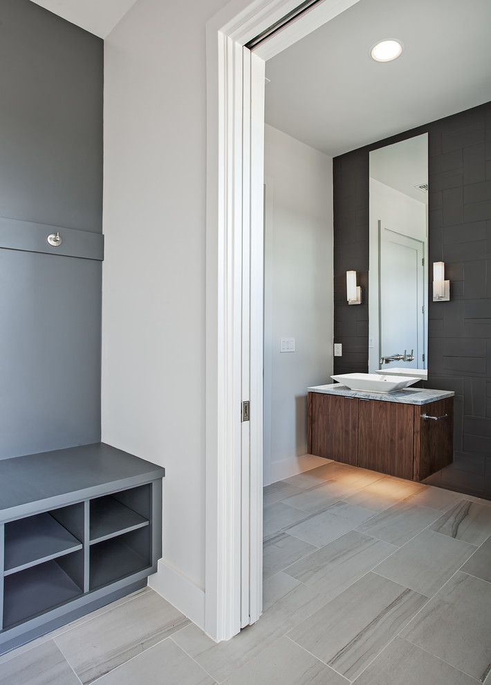 Inspiration for a medium sized contemporary shower room bathroom in Austin with flat-panel cabinets, dark wood cabinets, black tiles, ceramic tiles, black walls, cement flooring, a vessel sink, marble worktops and beige floors.