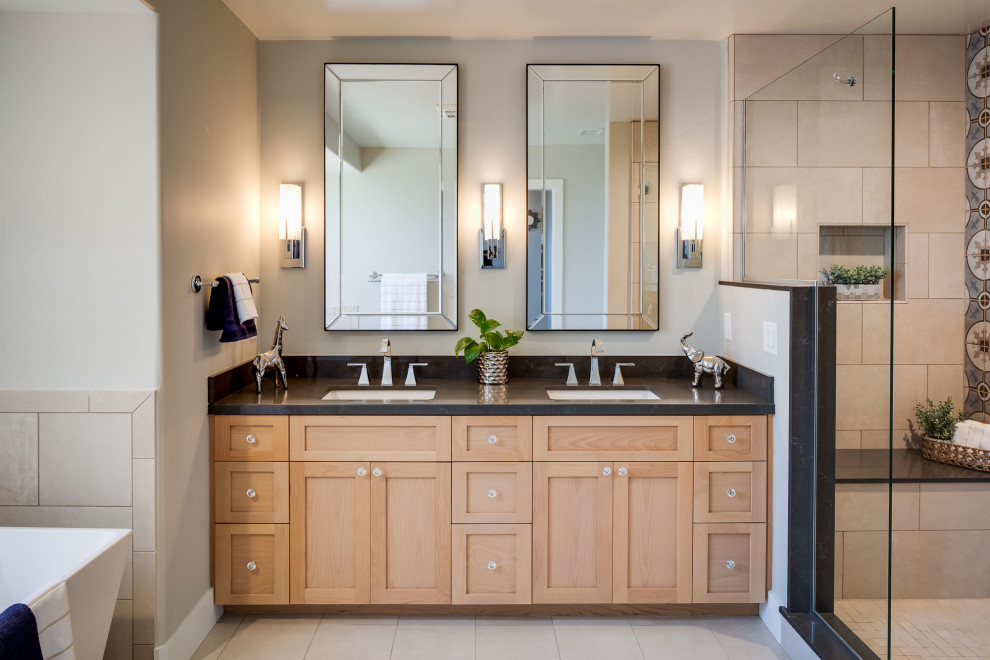 This is an example of a medium sized eclectic ensuite bathroom in San Diego with recessed-panel cabinets, light wood cabinets, a freestanding bath, a double shower, multi-coloured tiles, porcelain tiles, beige walls, ceramic flooring, a submerged sink, engineered stone worktops, beige floors, an open shower and black worktops.