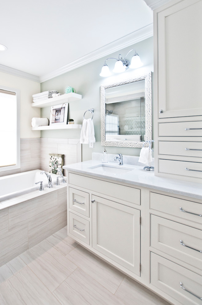 Bathroom - large transitional master white tile and porcelain tile porcelain tile and white floor bathroom idea in Nashville with recessed-panel cabinets, white cabinets, green walls, an undermount sink, quartz countertops, a hinged shower door and white countertops