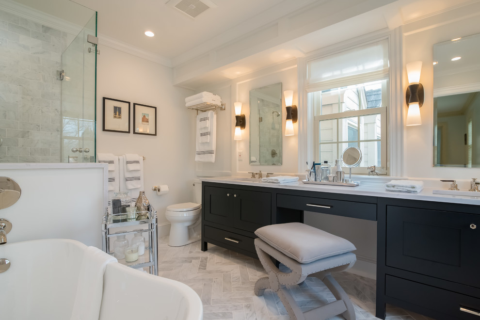 Bathroom - mid-sized transitional master white tile and marble tile marble floor and white floor bathroom idea in New York with shaker cabinets, black cabinets, a two-piece toilet, white walls, an undermount sink, quartz countertops and a hinged shower door