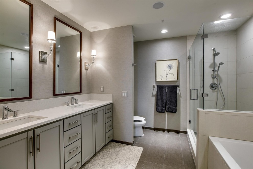 Design ideas for a medium sized contemporary ensuite bathroom in Nashville with shaker cabinets, grey cabinets, a built-in bath, a corner shower, a two-piece toilet, beige tiles, ceramic tiles, grey walls, ceramic flooring, a submerged sink and marble worktops.