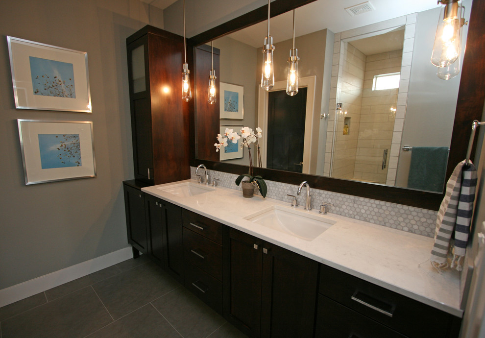 Inspiration for a medium sized traditional ensuite bathroom in Seattle with a submerged sink, freestanding cabinets, dark wood cabinets, engineered stone worktops, an alcove shower, a two-piece toilet, grey tiles, porcelain tiles, grey walls and porcelain flooring.
