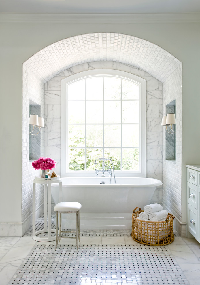 Example of a large classic master white tile marble floor freestanding bathtub design in Atlanta with recessed-panel cabinets, white cabinets and white walls