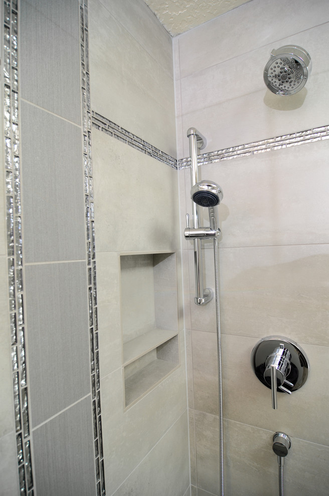 This is an example of a medium sized traditional ensuite bathroom in Portland with recessed-panel cabinets, white cabinets, a freestanding bath, an alcove shower, grey tiles, ceramic tiles, grey walls, ceramic flooring, a submerged sink and solid surface worktops.
