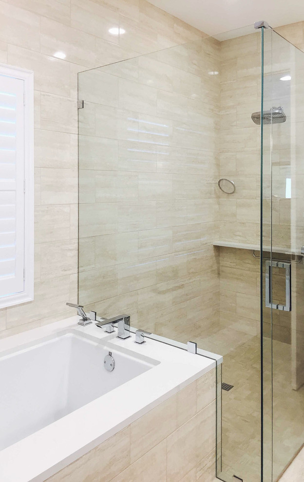 This is an example of a medium sized contemporary ensuite bathroom in Tampa with recessed-panel cabinets, dark wood cabinets, an alcove bath, a walk-in shower, a two-piece toilet, beige tiles, ceramic tiles, blue walls, ceramic flooring, a pedestal sink, engineered stone worktops, beige floors, a hinged door and white worktops.