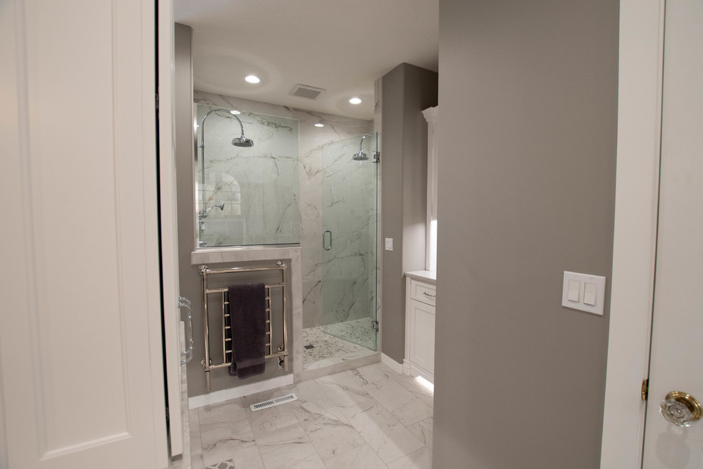 Inspiration for a timeless master marble floor and white floor bathroom remodel in Other with furniture-like cabinets, white cabinets, gray walls, an undermount sink, quartz countertops and a hinged shower door