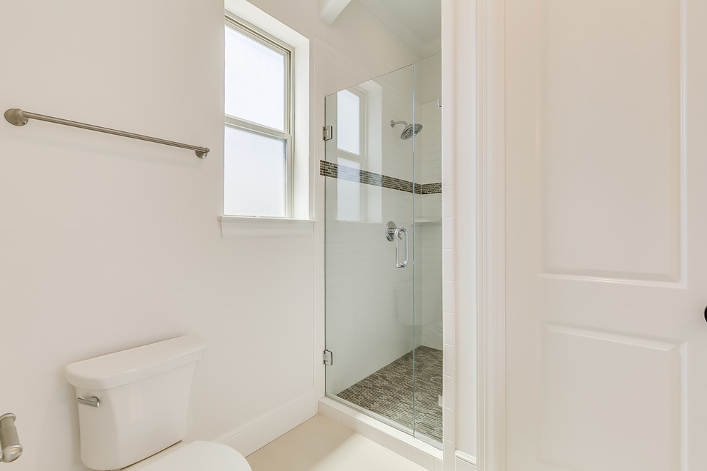 Inspiration for a mid-sized transitional 3/4 red tile and subway tile ceramic tile alcove shower remodel in Dallas with raised-panel cabinets, white cabinets, a one-piece toilet, beige walls and a drop-in sink