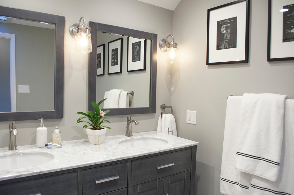 Mid-sized trendy kids' white tile and porcelain tile porcelain tile bathroom photo in Burlington with recessed-panel cabinets, distressed cabinets, a two-piece toilet, gray walls, marble countertops and an undermount sink