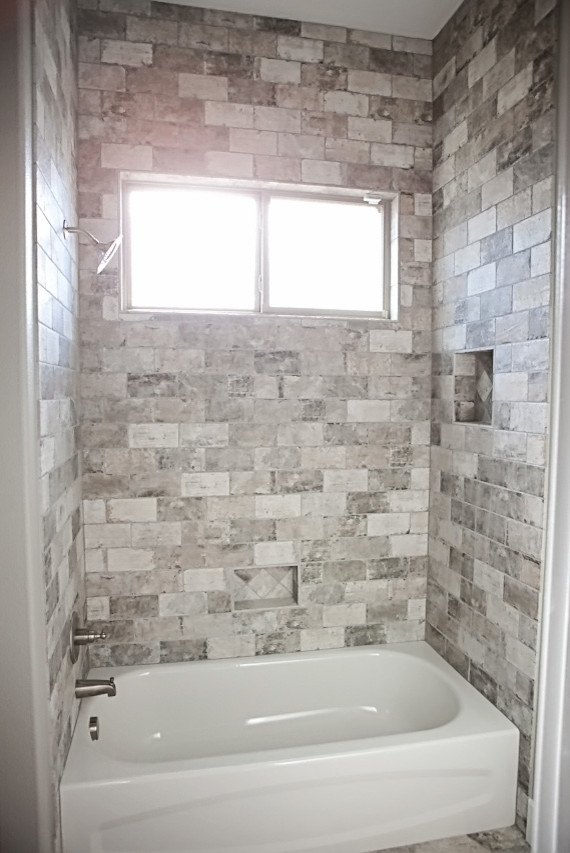 Small arts and crafts kids' multicolored tile and stone slab concrete floor drop-in bathtub photo in Austin with furniture-like cabinets, white cabinets, a two-piece toilet, white walls, an undermount sink and granite countertops