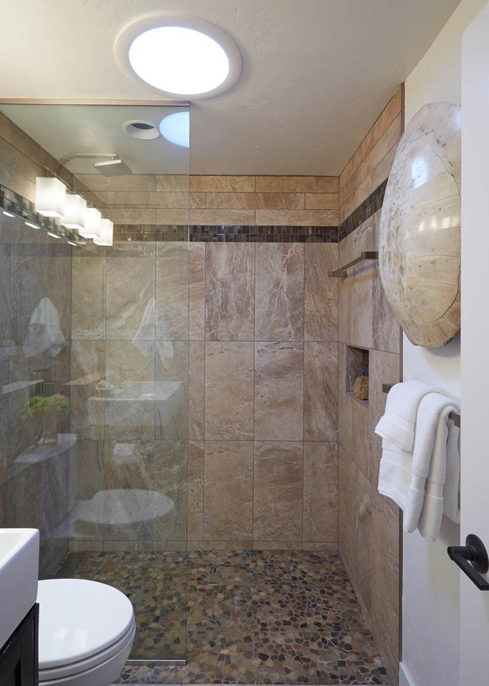 Design ideas for a small retro shower room bathroom in San Francisco with a console sink, recessed-panel cabinets, black cabinets, solid surface worktops, an alcove shower, a one-piece toilet, white tiles, stone tiles, beige walls and travertine flooring.