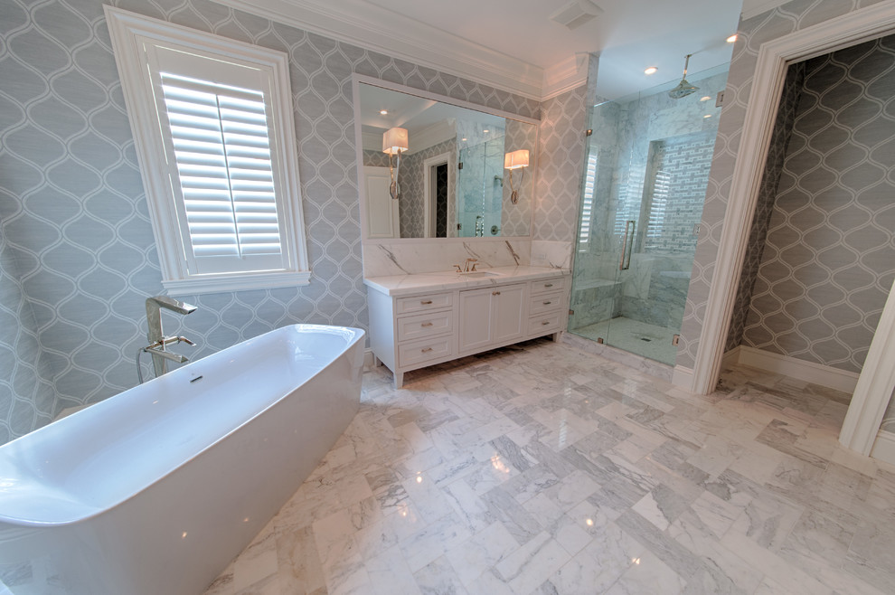 Large transitional master gray tile, white tile and stone slab marble floor and gray floor bathroom photo in Miami with shaker cabinets, white cabinets, gray walls, an undermount sink, marble countertops and a hinged shower door