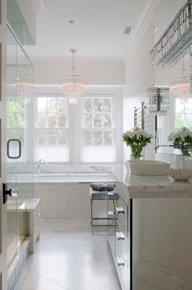 Photo of a large classic ensuite bathroom in Boston with a vessel sink, glass-front cabinets, a built-in bath, a corner shower, white walls, marble flooring, marble worktops and marble tiles.