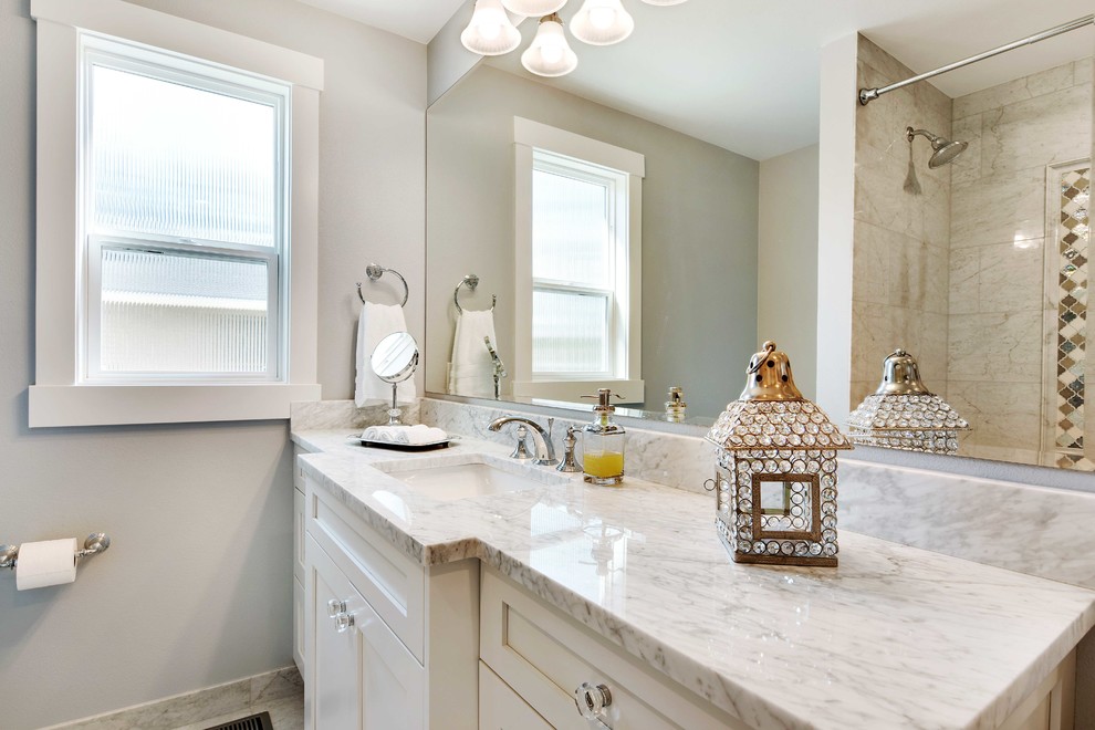 Bathroom - mid-sized transitional kids' white tile and stone tile marble floor bathroom idea in Seattle with shaker cabinets, white cabinets, a two-piece toilet, gray walls, an undermount sink and marble countertops