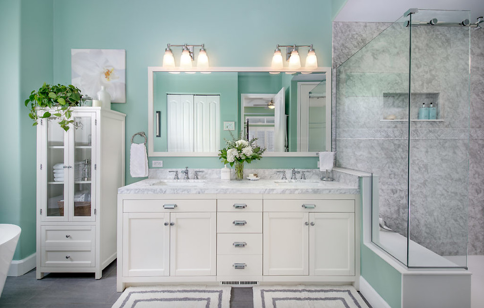 Large beach style master vinyl floor and gray floor bathroom photo in Seattle with recessed-panel cabinets, white cabinets, green walls, an undermount sink, marble countertops and gray countertops