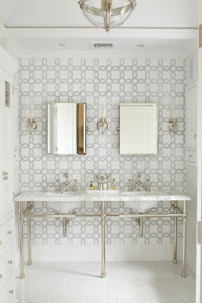 Mid-sized transitional master multicolored tile and mosaic tile mosaic tile floor alcove shower photo in New York with furniture-like cabinets, white cabinets, marble countertops, a two-piece toilet, gray walls and a console sink