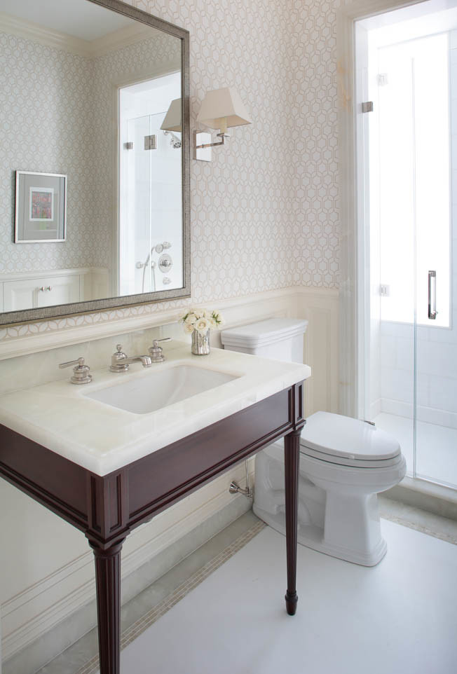 Inspiration for a mid-sized timeless 3/4 white tile and ceramic tile marble floor alcove shower remodel in New York with furniture-like cabinets, dark wood cabinets, a two-piece toilet, multicolored walls, a console sink and marble countertops