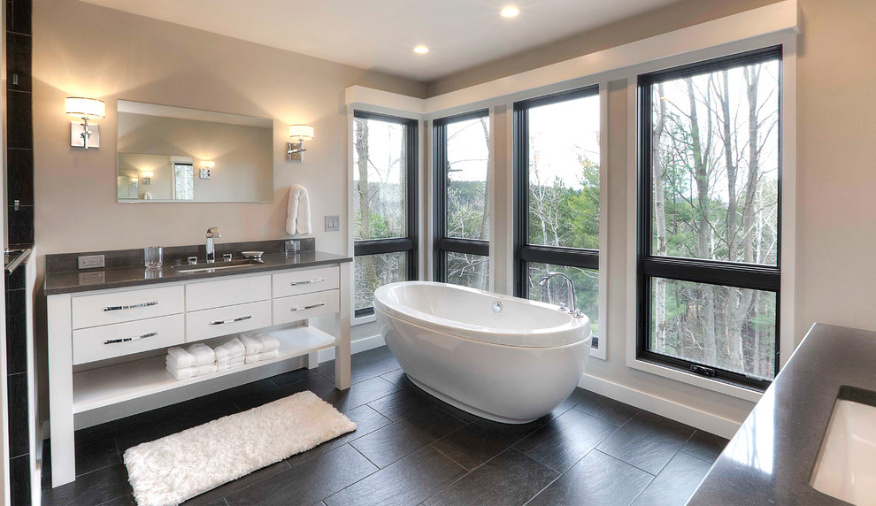 Bathroom - mid-sized transitional master gray tile and ceramic tile ceramic tile bathroom idea in Other with an undermount sink, furniture-like cabinets, white cabinets, quartz countertops and gray walls