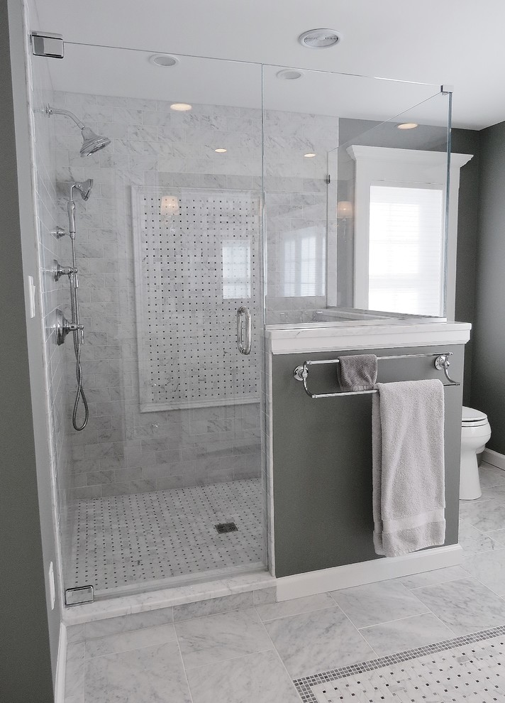 Large elegant master white tile and marble tile marble floor and gray floor doorless shower photo in Bridgeport with raised-panel cabinets, white cabinets, a two-piece toilet, gray walls, an undermount sink, marble countertops and a hinged shower door