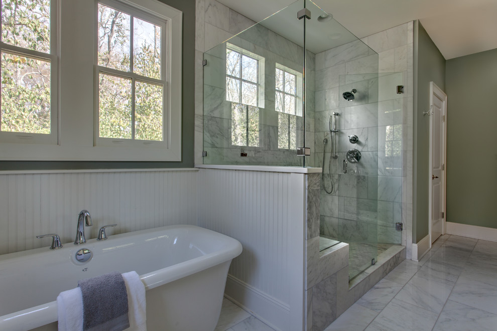 Example of a large mountain style master white tile marble floor freestanding bathtub design in Nashville with an undermount sink, recessed-panel cabinets and dark wood cabinets