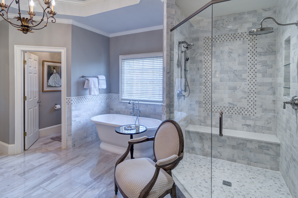 Example of a large classic master gray tile and stone tile porcelain tile and gray floor bathroom design in Atlanta with a drop-in sink, furniture-like cabinets, medium tone wood cabinets, quartzite countertops, gray walls and a hinged shower door