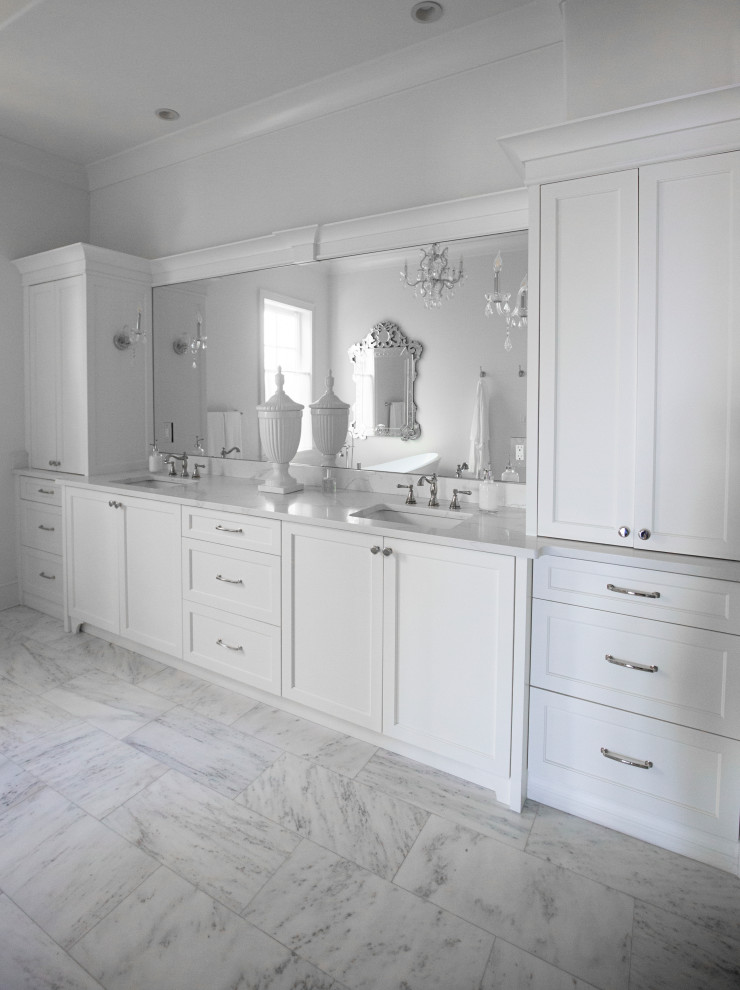 Inspiration for a large french country master marble floor, white floor, double-sink and tray ceiling freestanding bathtub remodel in Miami with shaker cabinets, white cabinets, white walls, a drop-in sink, quartzite countertops, white countertops and a built-in vanity