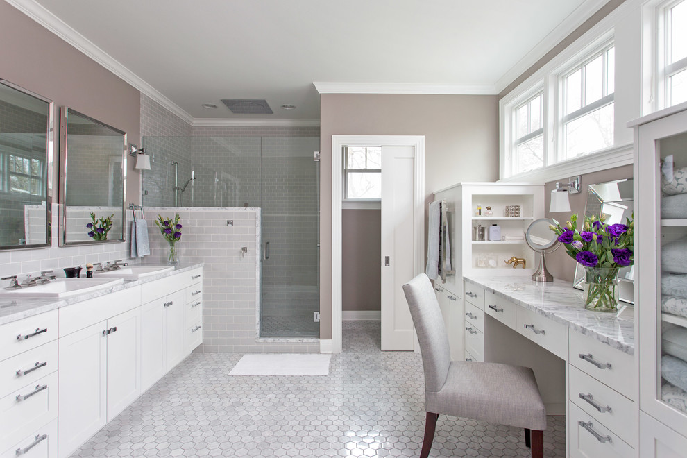 Mid-sized elegant master subway tile and gray tile marble floor corner shower photo in Austin with shaker cabinets, white cabinets, gray walls and marble countertops