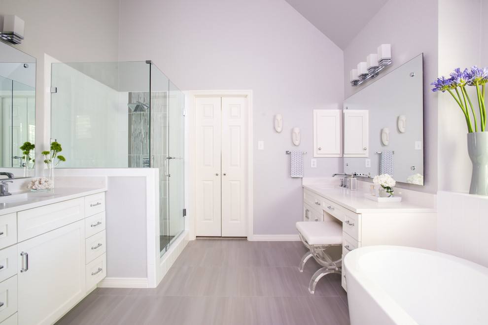 Example of a mid-sized trendy master gray tile and glass tile porcelain tile bathroom design in Dallas with a drop-in sink, flat-panel cabinets, yellow cabinets, quartz countertops, a one-piece toilet and gray walls