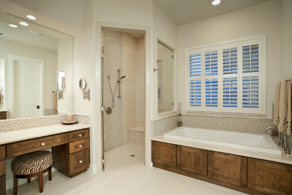 Example of a transitional master beige tile and porcelain tile porcelain tile bathroom design in Austin with an undermount sink, medium tone wood cabinets, marble countertops and shaker cabinets