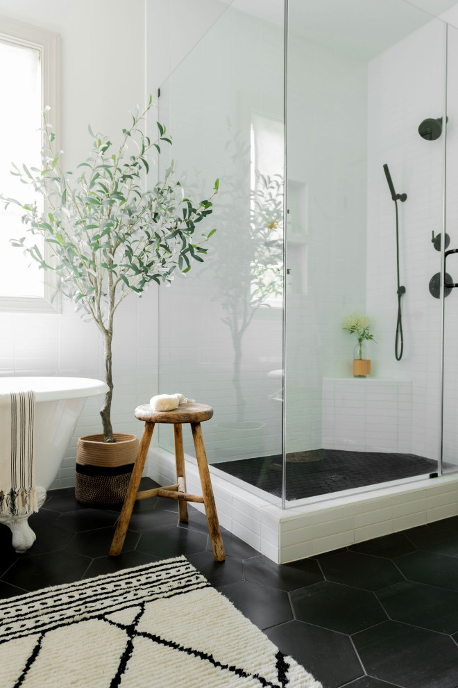 Example of a minimalist master white tile and ceramic tile black floor and double-sink bathroom design in Nashville with black cabinets, white walls, an undermount sink, quartz countertops, a hinged shower door, white countertops, a niche and a built-in vanity