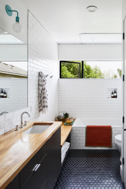 Timeless Contrast: Bathroom Storage with Black and White Countertops