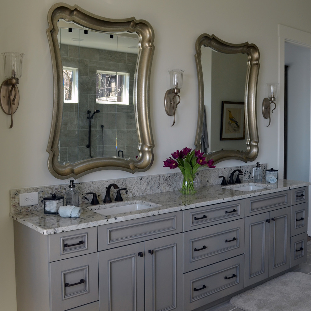 Inspiration for a mid-sized timeless master gray floor bathroom remodel in Other with beaded inset cabinets, gray cabinets, white walls, an undermount sink and granite countertops