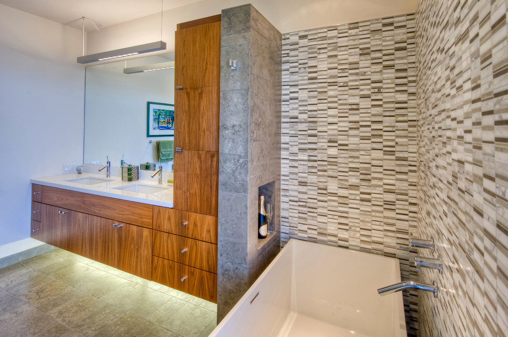 Minimalist master beige tile, gray tile, multicolored tile, white tile and mosaic tile porcelain tile bathroom photo in San Francisco with flat-panel cabinets, medium tone wood cabinets, white walls, an undermount sink, quartzite countertops, a hinged shower door and white countertops