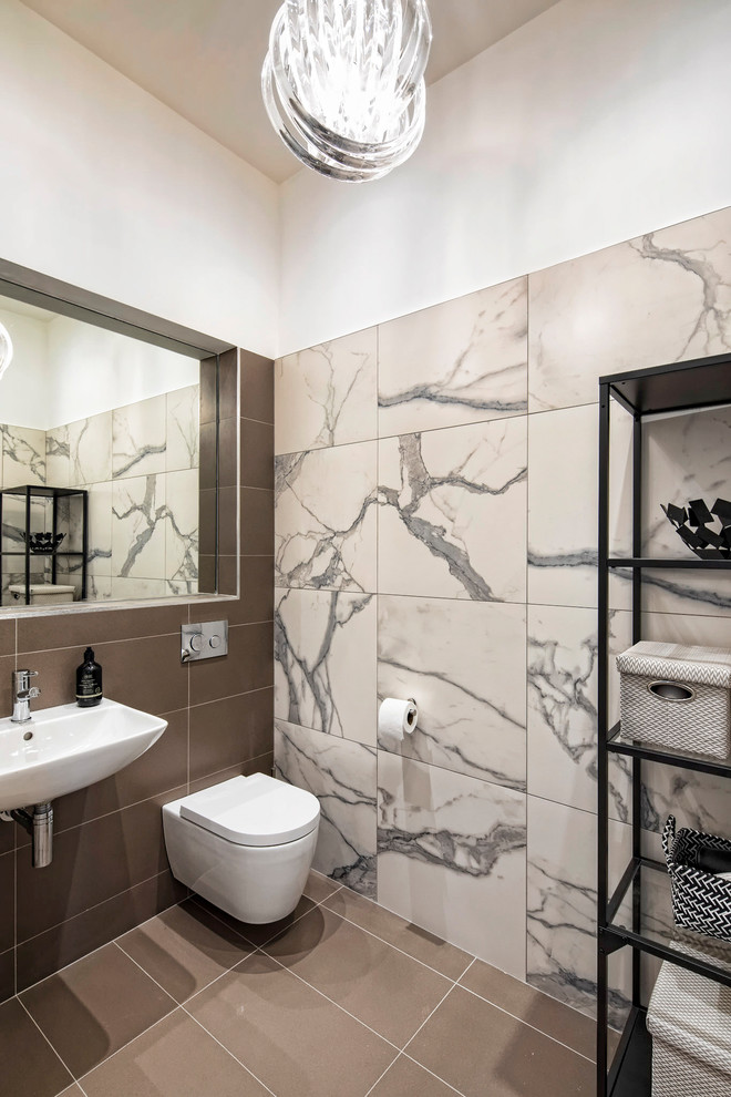 Medium sized contemporary bathroom in Dublin with a wall mounted toilet, beige tiles, ceramic tiles, white walls, porcelain flooring, a wall-mounted sink and brown floors.